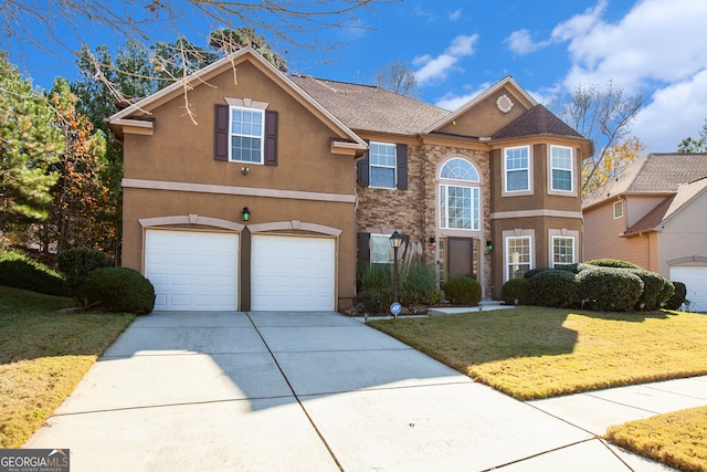 front facade featuring a front yard and a garage