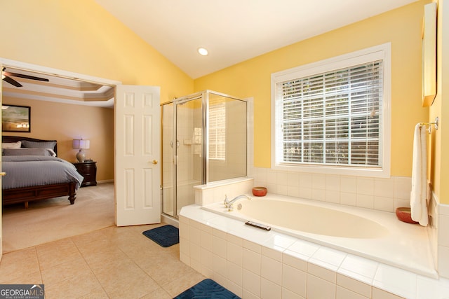 bathroom featuring tile patterned flooring, separate shower and tub, vaulted ceiling, and ceiling fan