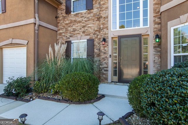 property entrance featuring a garage