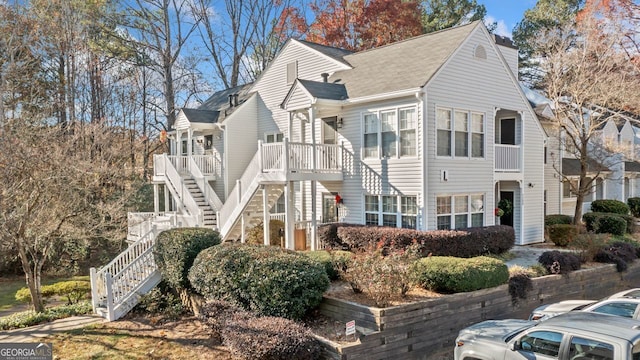 1115 Cannongate Xing SW, Marietta, GA 30064 - view of side of property featuring stairs and a shingled roof