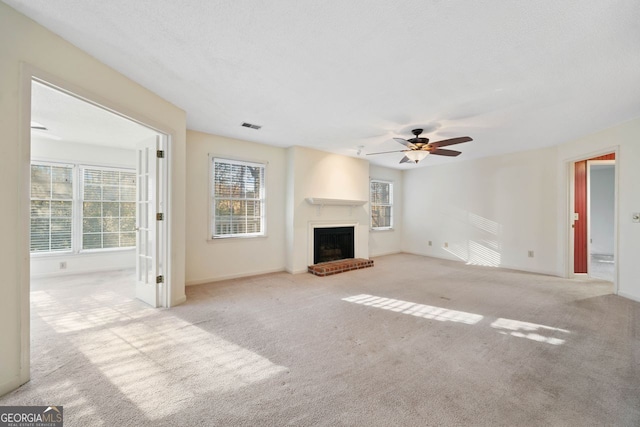 1115 Cannongate Xing SW, Marietta, GA 30064 - unfurnished living room featuring carpet floors, a ceiling fan, and a fireplace