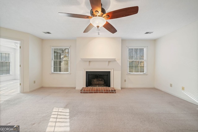 1115 Cannongate Xing SW, Marietta, GA 30064 - unfurnished living room with a fireplace, healthy amount of natural light, carpet floors, and ceiling fan