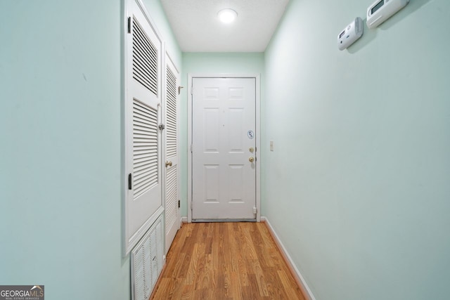 1115 Cannongate Xing SW, Marietta, GA 30064 - doorway with light wood finished floors and baseboards