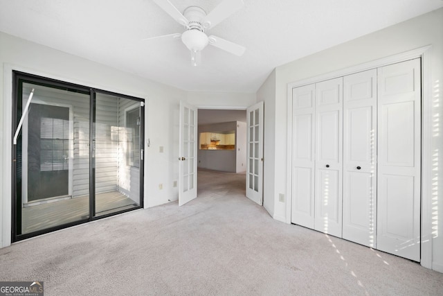 1115 Cannongate Xing SW, Marietta, GA 30064 - unfurnished bedroom with french doors, carpet flooring, access to exterior, a closet, and a ceiling fan