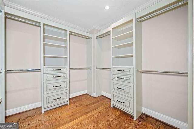 spacious closet with light hardwood / wood-style floors