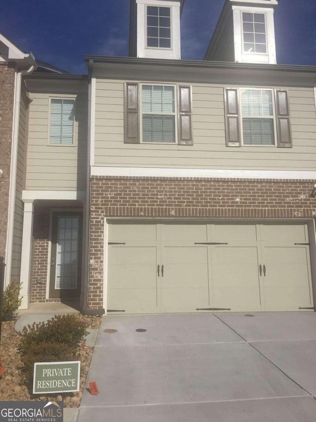 view of front of property featuring a garage