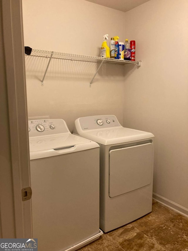 laundry room with washing machine and dryer