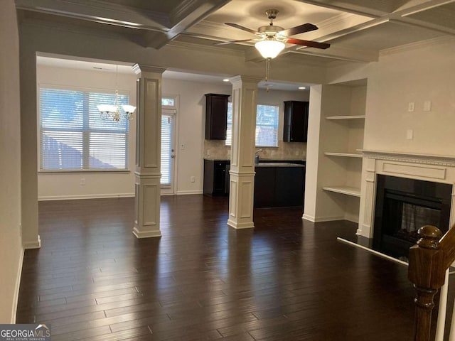 unfurnished living room featuring dark hardwood / wood-style flooring, plenty of natural light, and coffered ceiling