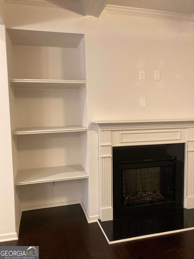 details featuring wood-type flooring and crown molding