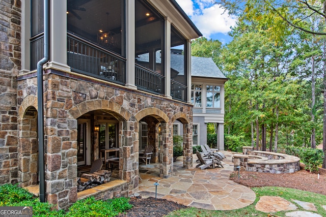 view of patio / terrace with a sunroom