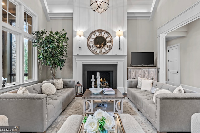 living room with high vaulted ceiling and a chandelier