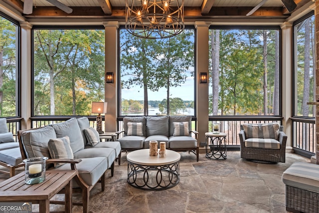 sunroom featuring plenty of natural light and wood ceiling