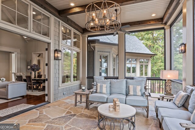 sunroom with beamed ceiling, wood ceiling, and an inviting chandelier