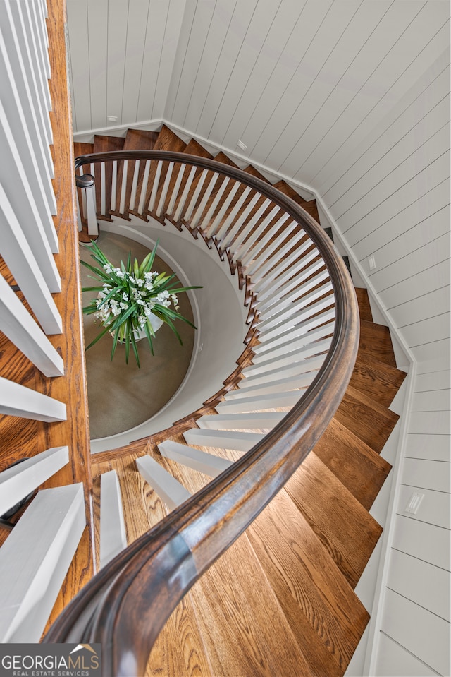 staircase with wooden walls