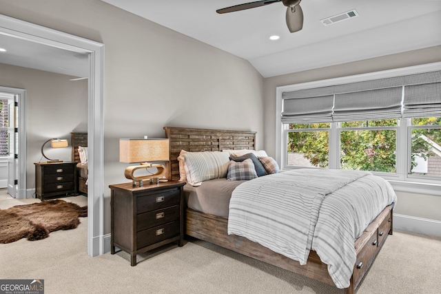 bedroom featuring ceiling fan, light carpet, and vaulted ceiling