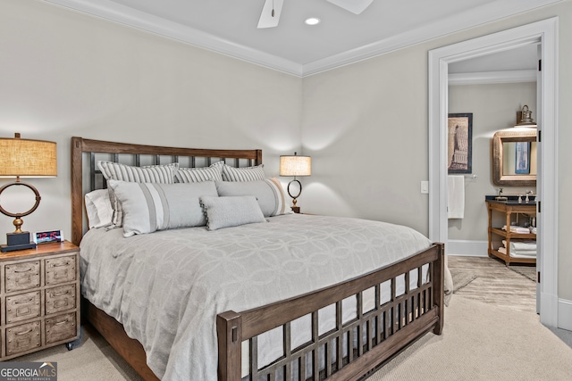 carpeted bedroom with ceiling fan and ornamental molding