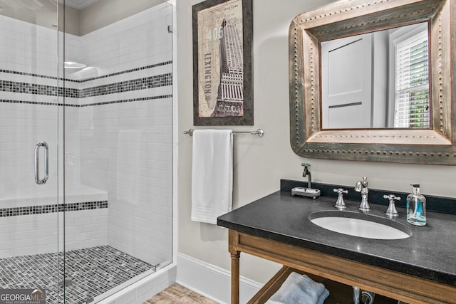 bathroom with vanity and an enclosed shower