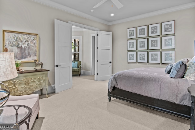 carpeted bedroom with ceiling fan and ornamental molding