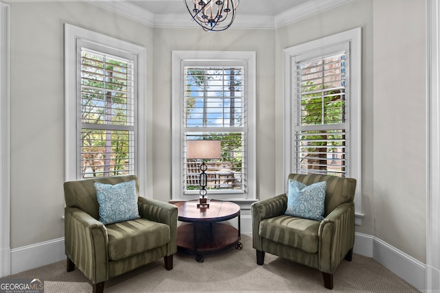 living area featuring carpet flooring, a chandelier, crown molding, and a healthy amount of sunlight