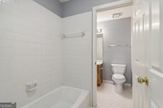 bathroom featuring tile patterned flooring, vanity, and toilet