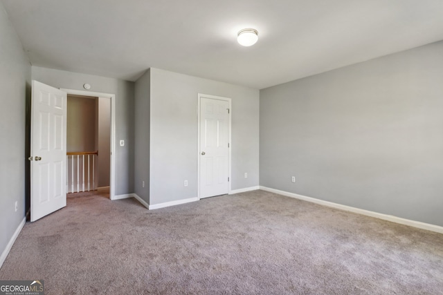 unfurnished bedroom with carpet floors