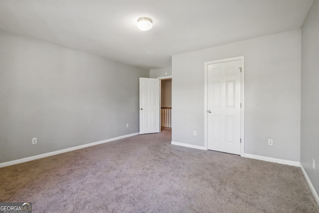 unfurnished bedroom with carpet