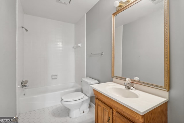 full bathroom featuring tile patterned flooring, vanity, tiled shower / bath combo, and toilet