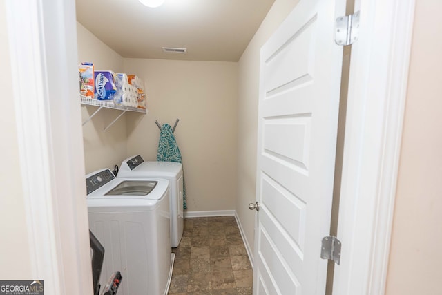 clothes washing area featuring washing machine and dryer