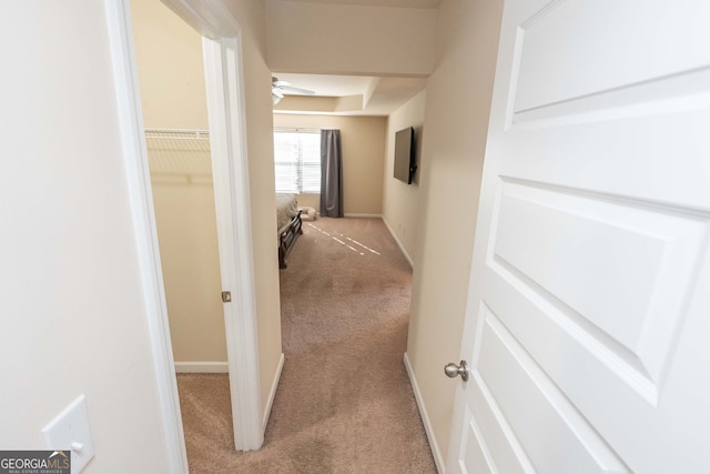 corridor with light colored carpet