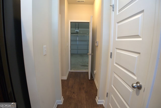 hallway featuring dark hardwood / wood-style floors