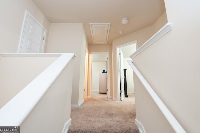 hallway with light carpet