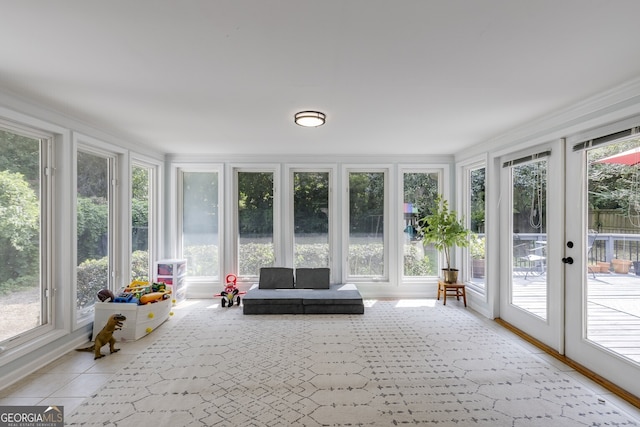 unfurnished sunroom featuring french doors