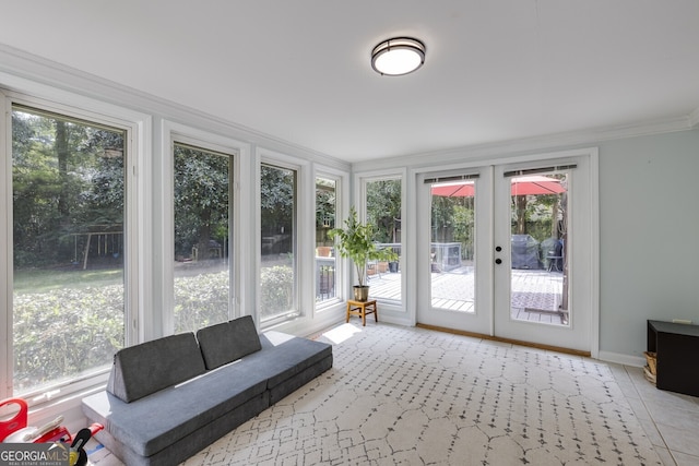 sunroom with a healthy amount of sunlight and french doors