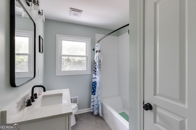 full bathroom with tile patterned flooring, vanity, toilet, and shower / tub combo