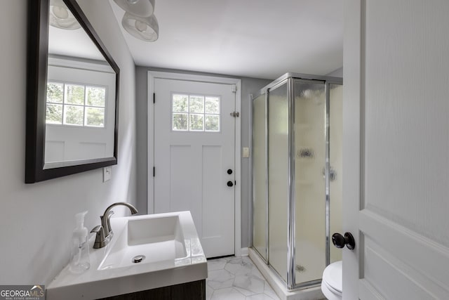 bathroom with vanity, toilet, and walk in shower