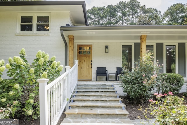 property entrance featuring covered porch