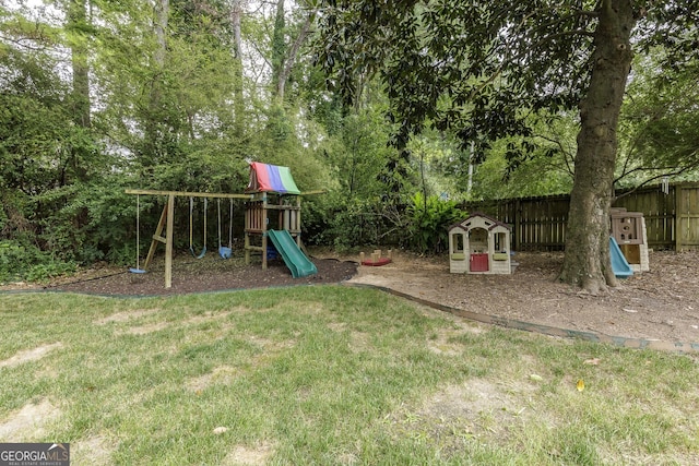 view of jungle gym with a lawn