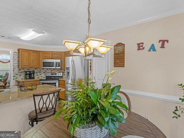 dining area featuring hardwood / wood-style flooring and ornamental molding