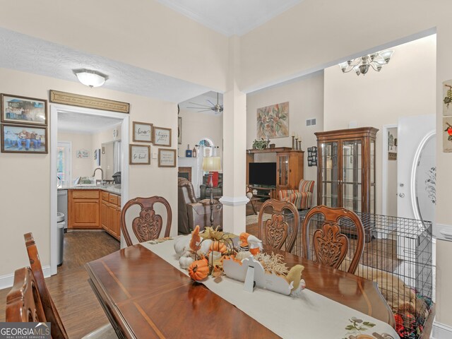 carpeted bedroom featuring a tray ceiling, connected bathroom, and ceiling fan