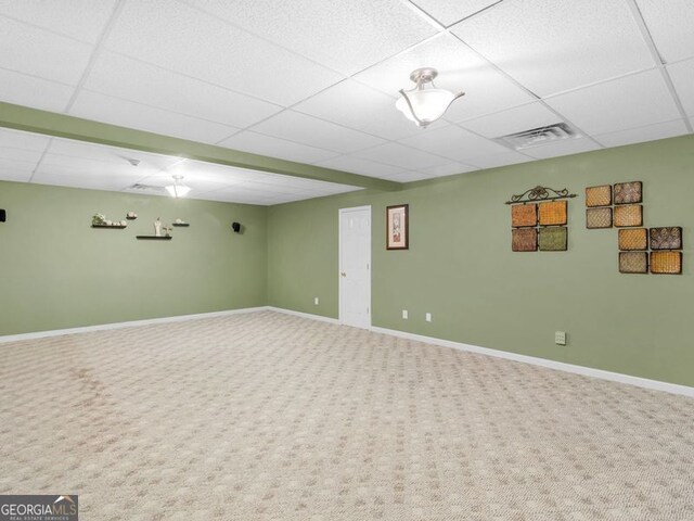 entrance foyer featuring carpet and a drop ceiling