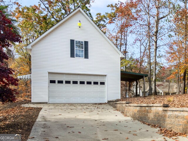 garage with a workshop area and a garage door opener