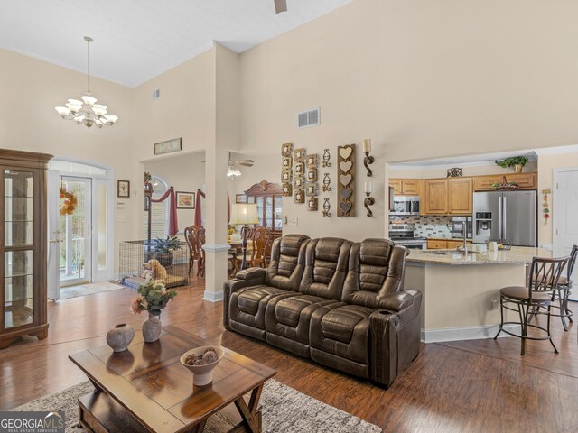 kitchen with backsplash, crown molding, sink, and appliances with stainless steel finishes