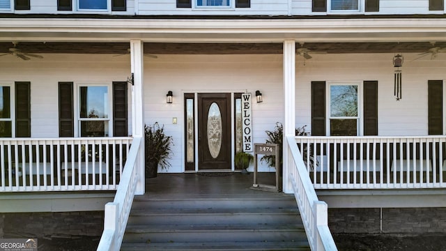 property entrance featuring ceiling fan and covered porch