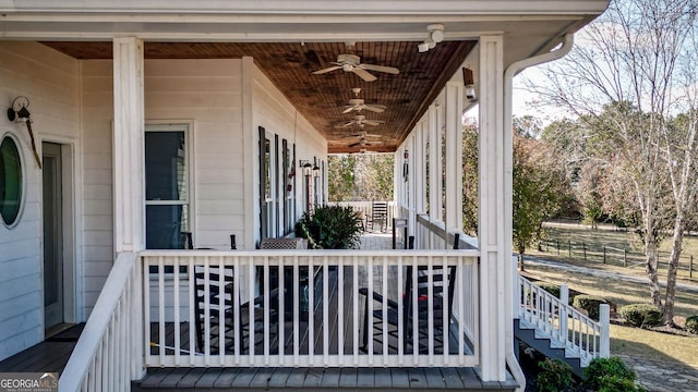 wooden deck featuring ceiling fan