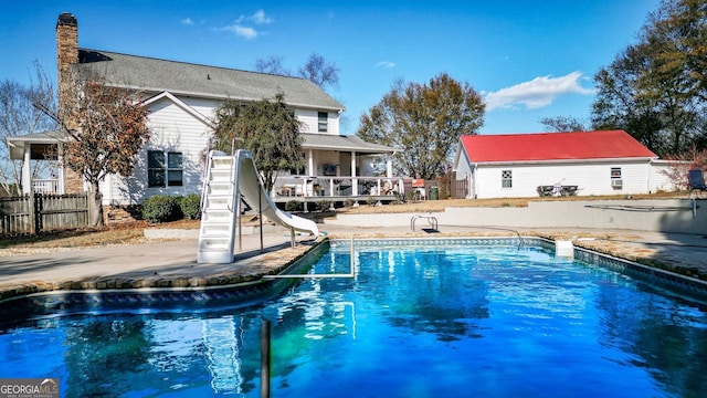 view of pool with a water slide