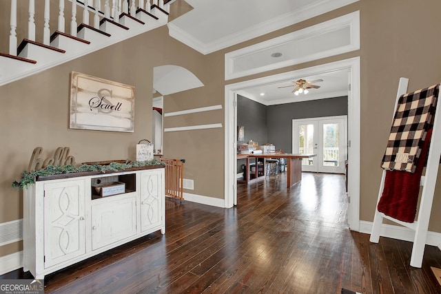 interior space with french doors, crown molding, ceiling fan, and dark wood-type flooring