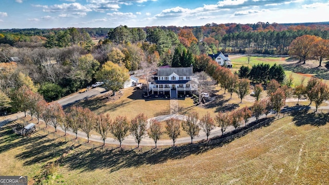 birds eye view of property with a rural view