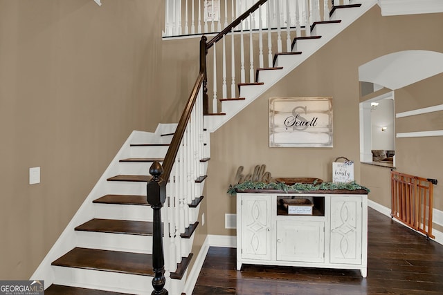 stairs with hardwood / wood-style floors