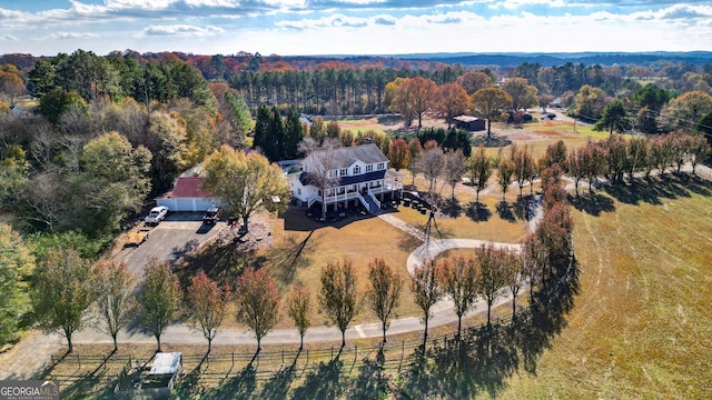 birds eye view of property featuring a rural view