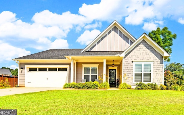 craftsman house featuring a front yard and a garage